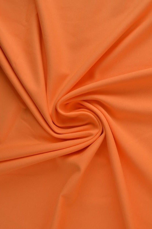 ORANSJE BOMULLSJERSEYSTOFF – NATURLIG, PUSTENDE & ELASTISK