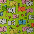 GRØNN BOMULLSPOPLIN MED KAWAII BAMSETRYKK