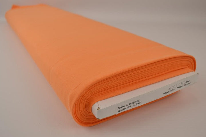 ORANSJE BOMULLSJERSEYSTOFF – NATURLIG, PUSTENDE & ELASTISK