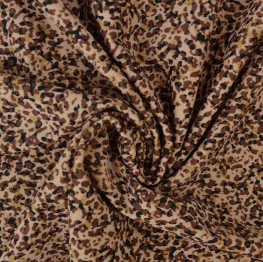 Beige lycra stoff – leopardtrykk, 4-veis strekk & hurtigtørkende (bilde 1 av 3)